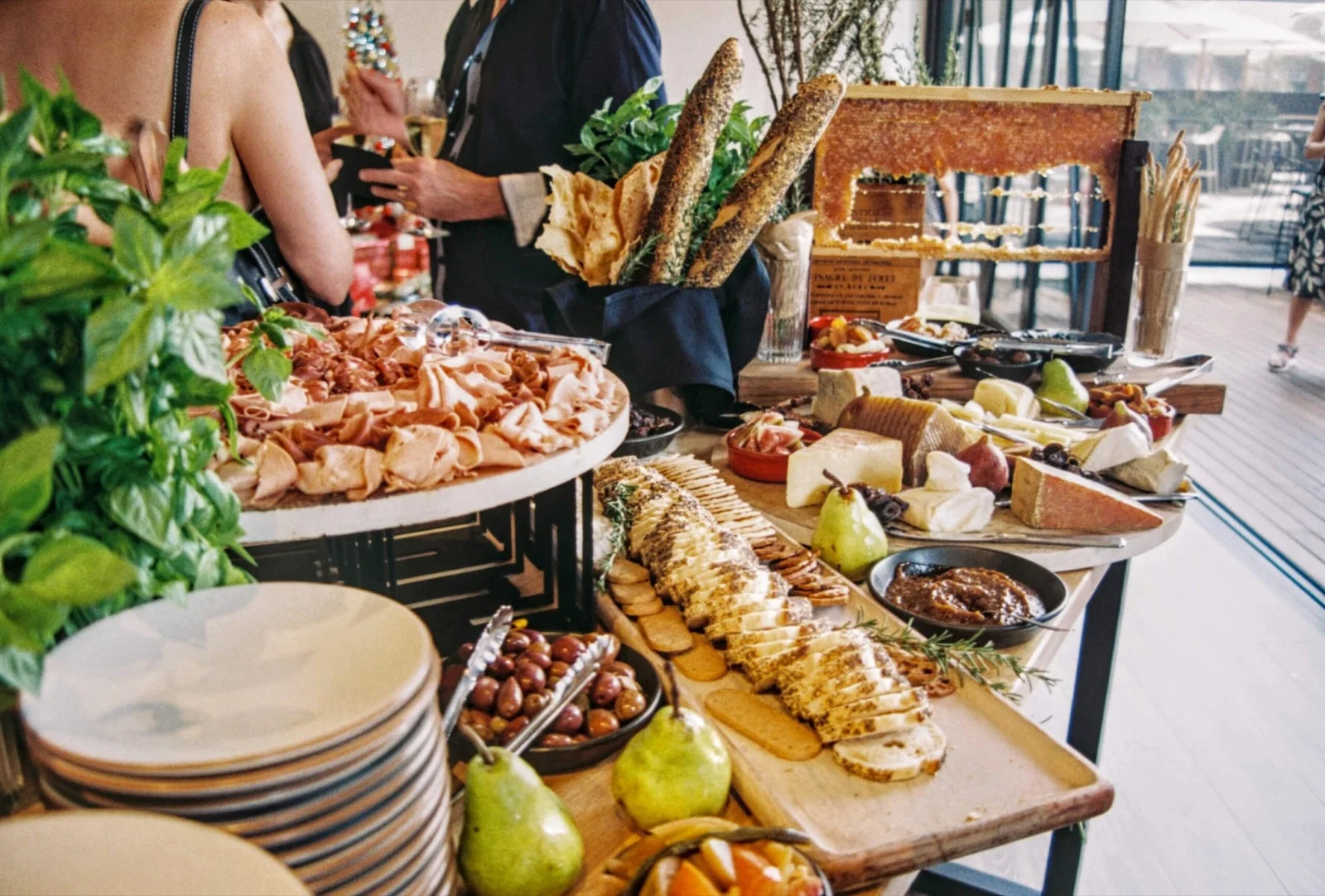 Buffet of charcuterie, cheeses and breads at a reception