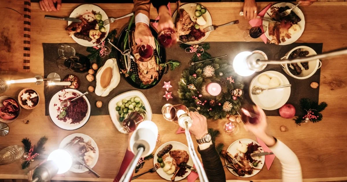 Holiday meal shared around a table, seen from above